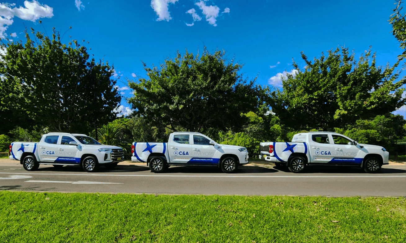 Row Of Cars With C&Amp;A Surveyors Logo