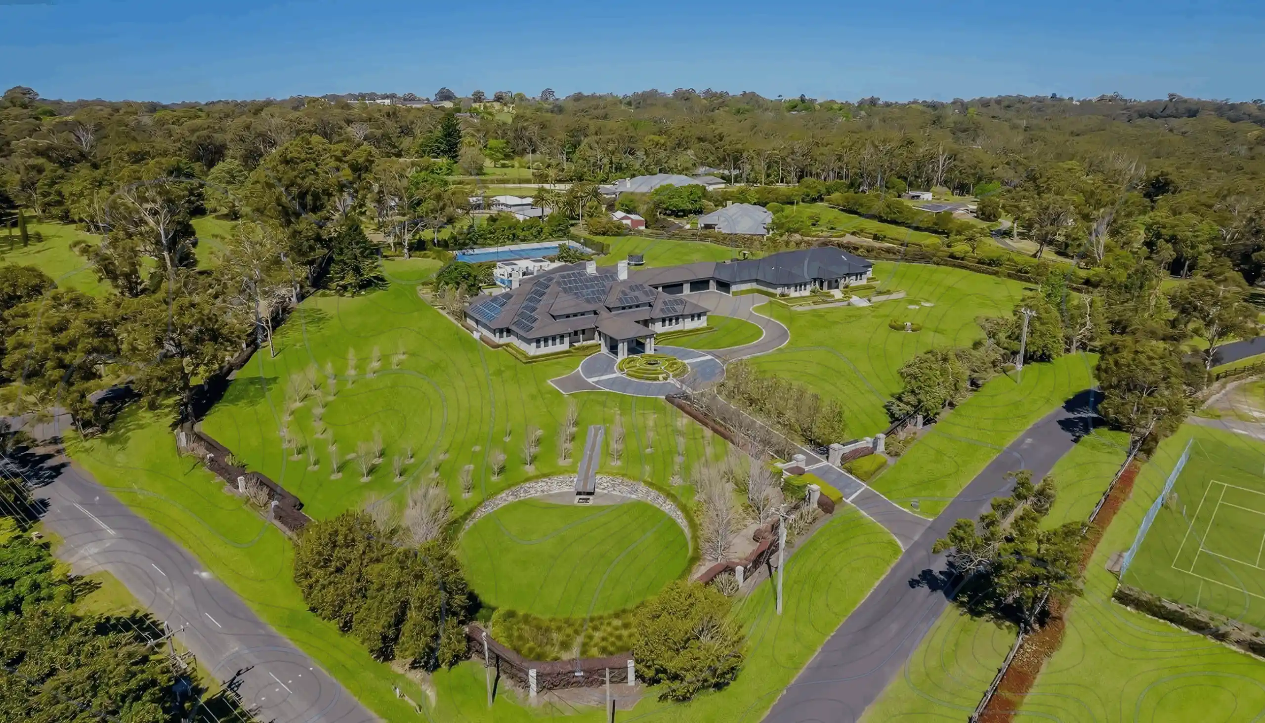 A House On A Wide Estate Surrounded By Trees